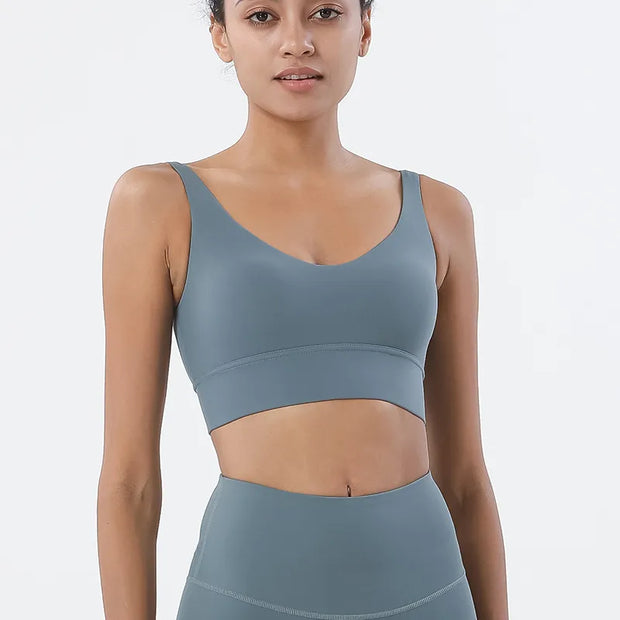 Women Tight Workout Sports Bra with high support and moisture-wicking fabric, designed for comfort and performance during intense workouts and fitness activities.