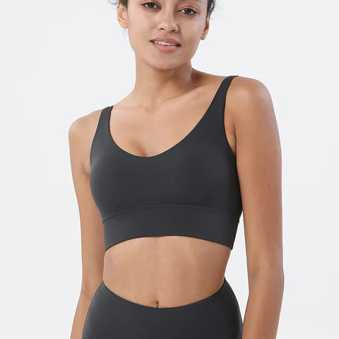 Women Tight Workout Sports Bra with high support and moisture-wicking fabric, designed for comfort and performance during intense workouts and fitness activities.