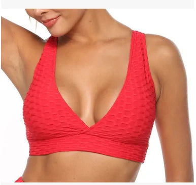 Women Fitness Deep V-neck Backless Breathable Bra with push-up support, designed for comfort and unrestricted movement during workouts, featuring moisture-wicking fabric.