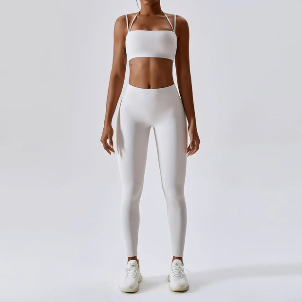 Women's Yoga Activewear Set including a supportive sports bra and high-waist leggings, made from breathable, stretchy fabric for optimal comfort and flexibility during yoga sessions.