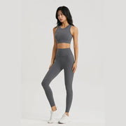 Women Sportswear Yoga Set including a top and leggings, made from breathable, stretchy fabric for maximum comfort and flexibility during yoga and fitness sessions.