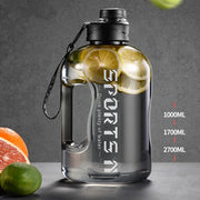 Fitness Large Water Bottle with high capacity, leak-proof design, and easy-carry handle, perfect for staying hydrated during workouts and outdoor activities.