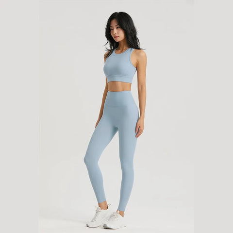 Women Sportswear Yoga Set including a top and leggings, made from breathable, stretchy fabric for maximum comfort and flexibility during yoga and fitness sessions.