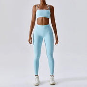 Women's Yoga Activewear Set including a supportive sports bra and high-waist leggings, made from breathable, stretchy fabric for optimal comfort and flexibility during yoga sessions.