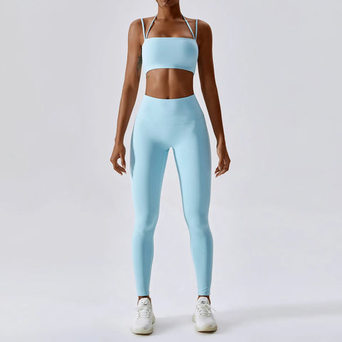 Women's Yoga Activewear Set including a supportive sports bra and high-waist leggings, made from breathable, stretchy fabric for optimal comfort and flexibility during yoga sessions.