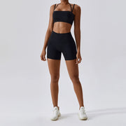 Women's Yoga Activewear Set including a supportive sports bra and high-waist leggings, made from breathable, stretchy fabric for optimal comfort and flexibility during yoga sessions.