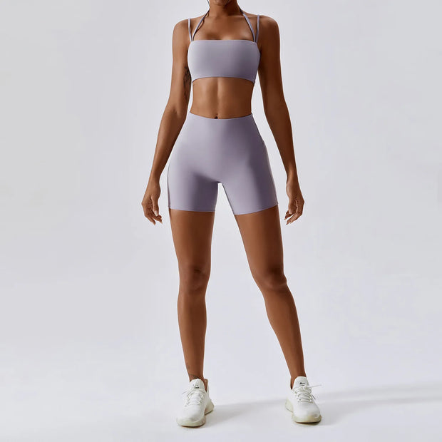 Women's Yoga Activewear Set including a supportive sports bra and high-waist leggings, made from breathable, stretchy fabric for optimal comfort and flexibility during yoga sessions.