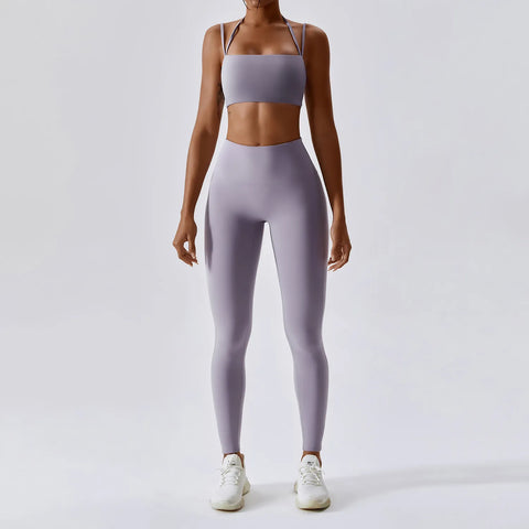 Women's Yoga Activewear Set including a supportive sports bra and high-waist leggings, made from breathable, stretchy fabric for optimal comfort and flexibility during yoga sessions.